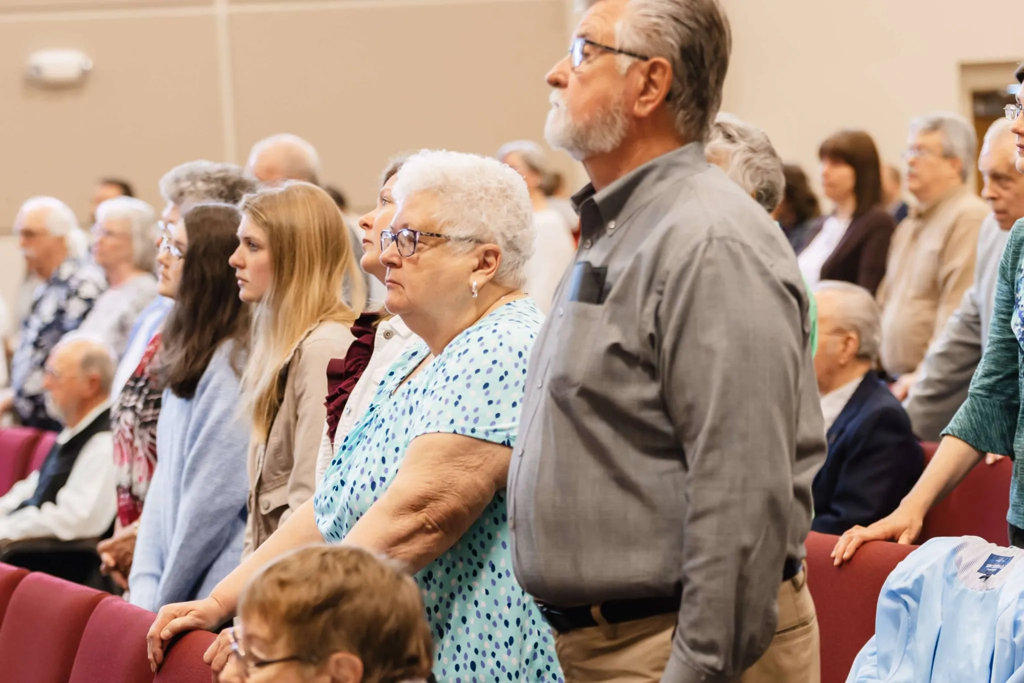 Group of people singing during a service